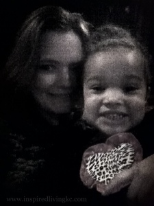 On my lap, still smiling before the movie.